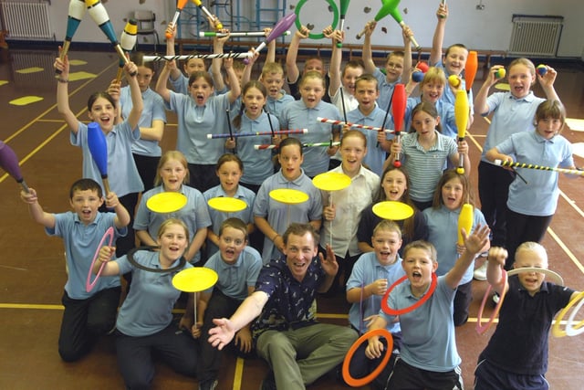 Year 6 pupils had a wonderful time when they practised circus skills with visiting tutor Mike Lee in 2004.