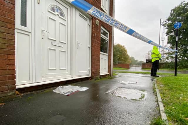 A police cordon was put in place after a man wearing blood-stained clothes knocked on a window of a house in Beverley Court this morning.