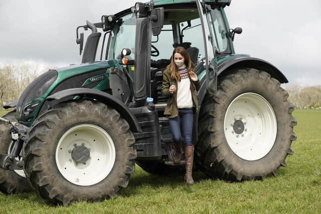 The Duchess of Cambridge steps from a tractor