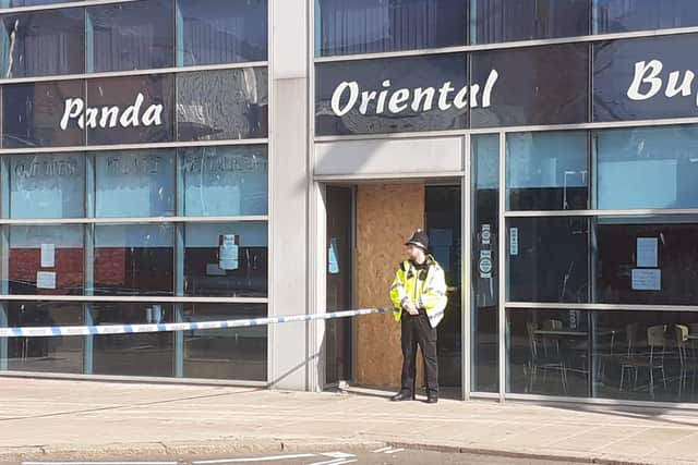 A police cordon remained in place outside Panda Oriental Buffet restaurant on Wednesday, August 11.