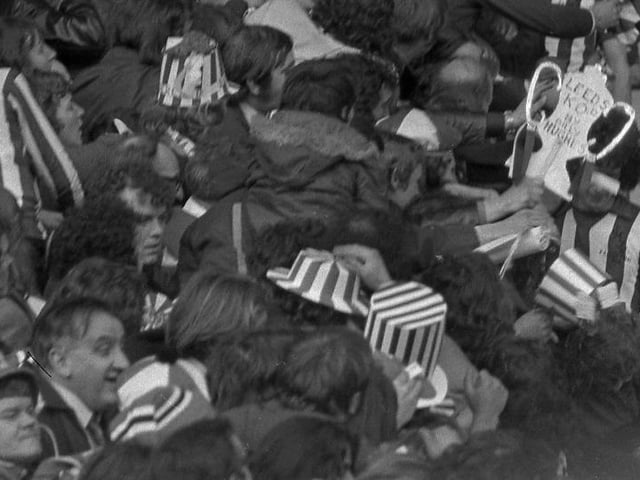 Richie Pitt goes past the massed ranks of the Sunderland fans.