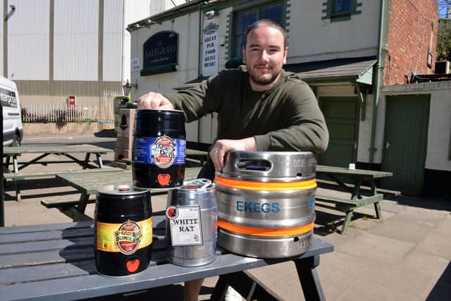 Craft ale kegs are also available at The Saltgrass. Pictured here is owner Walter Veti.