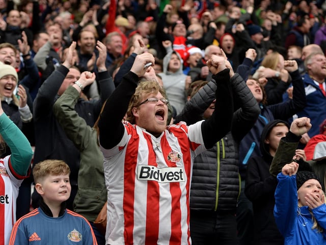 Sunderland supporters celebrate their team's third goal during the Premier League match between Sunderland and Chelsea at the Stadium of Light on May 7, 2016.