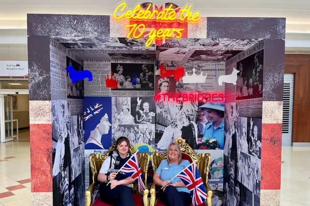 Pictured at the jubilee photobooth are (left to right) Bridges' security officer Shannon Cuthbert and Allison Robson of customer service.