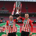 Lynden Gooch and Max Power of Sunderland celebrate with the Papa John's Trophy after the Papa John's Trophy Final match against Tranmere Rovers on March 14, 2021