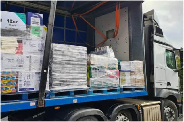 A HGV was carrying hundreds of cans of pop on wooden pallets that had not been secured.