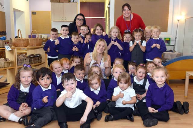 Early Years lead Catherine White, centre, with pupils and staff at Marlborough Primary School, nominated in the Early Years in School category at the Nursery World awards.