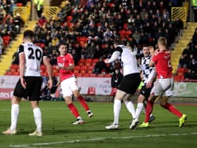 Charlton Athletic's Jayden Stockley (right) scores their side's second goal of the game, after a shot by team-mate Ben Purrington ricochets off his back during the Emirates FA Cup Second Round match at the Gateshead International Stadium. PA.