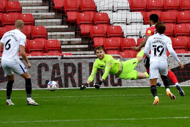 Lee Burge makes a save on his busiest afternoon of the season so far