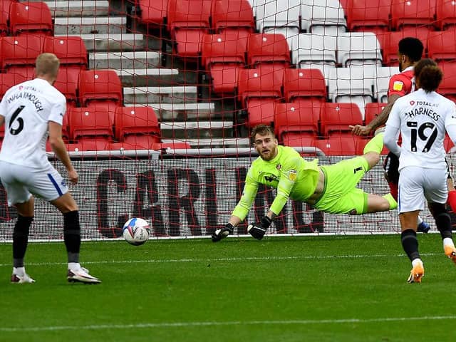 Lee Burge makes a save on his busiest afternoon of the season so far
