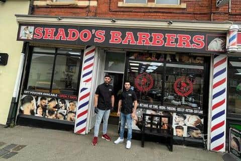 Basil and Shado Hasso outside Shado's Barbers