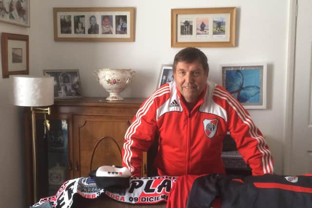 Peter Farrer with some of the River Plate merchandise he's been sent by the club.