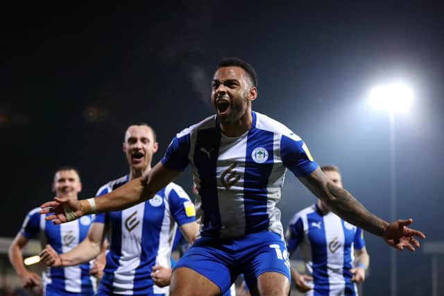 FLEETWOOD, ENGLAND - NOVEMBER 02: Curtis Tilt of Wigan Athletic celebrates after scoring their side's third goal during the Sky Bet League One match between Fleetwood Town and Wigan Athletic at Highbury Stadium on November 02, 2021 in Fleetwood, England. (Photo by Lewis Storey/Getty Images)