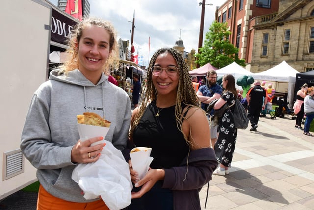Sunderland University students Ffion Vickers and Nicole Serio-Joseph enjoying one of the many culinary delights on offer.