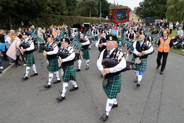 Houghton pipe band leads the parade