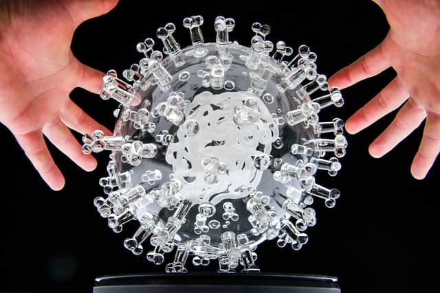 The glass sculpture of the coronavirus by Bristol-based artist Luke Jerram, which, measuring 23cm in diameter, is a million times larger than the actual virus.