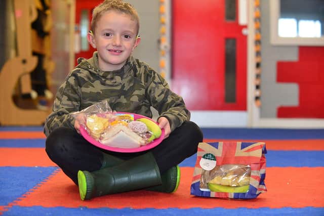 The youth project has been running activities for children throughout the half-term week. Luke with one of the packed lunches.