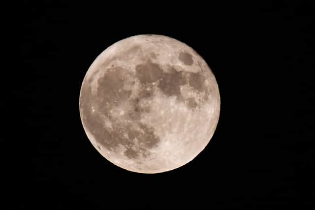 The first full moon of 2023 will be on Friday. (Photo by OLIVIER DOULIERY/AFP via Getty Images)