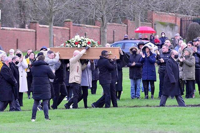 Leon Hetherington's coffin is carried to his grave at Bishopwearmouth Cemetery mourners clap in respect. Picture by Frank Reid