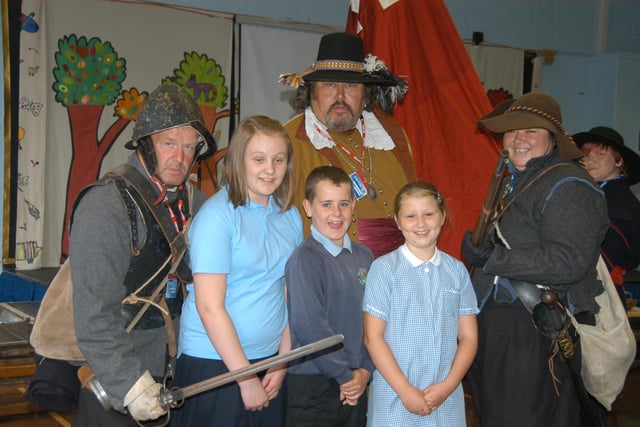 Surrounded by the keepers of Hylton Castle in 2010 were Hylton Castle Primary School pupils Jade Miller 10, Corrie Walt 10, and Katie Jeffrey 10 during their school's visit by the Hylton Castle re-enactment group.