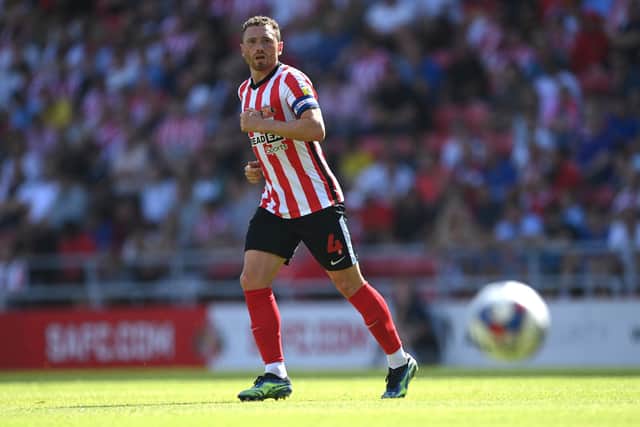 SUNDERLAND, ENGLAND - AUGUST 13: Corry Evans of Sunderland in action during the Sky Bet Championship between Sunderland and Queens Park Rangers at Stadium of Light on August 13, 2022 in Sunderland, England. (Photo by Stu Forster/Getty Images)