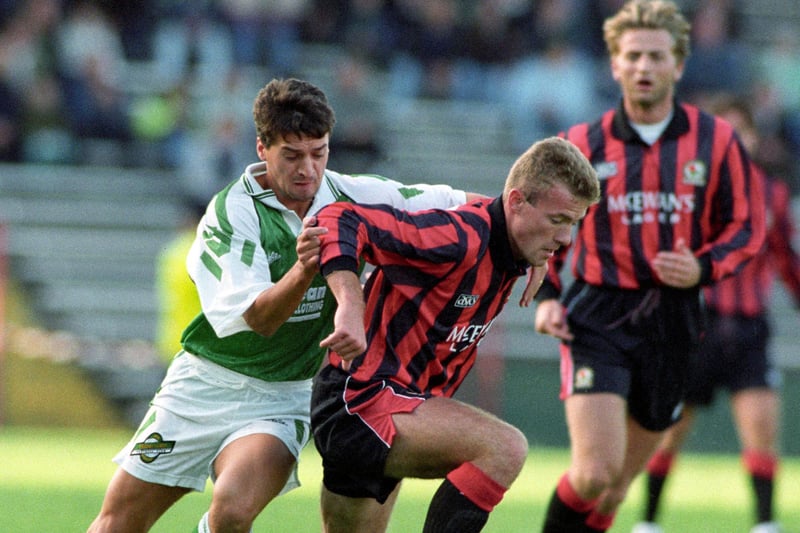 Pat McGinlay challenges Blackburn Rovers striker Alan Shearer watched by Tim Sherwood during a pre-season friendly at Easter Road in July 1992. Hibs won 3-0.