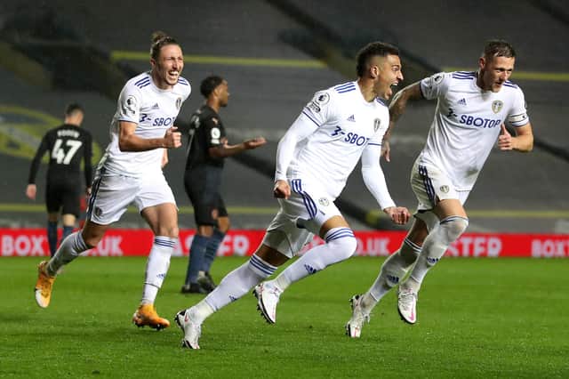 LEEDS, ENGLAND - OCTOBER 03: Rodrigo Moreno of Leeds United celebrates after scoring his team's first goal during the Premier League match between Leeds United and Manchester City at Elland Road on October 03, 2020 in Leeds, England. Sporting stadiums around the UK remain under strict restrictions due to the Coronavirus Pandemic as Government social distancing laws prohibit fans inside venues resulting in games being played behind closed doors. (Photo by Catherine Ivill/Getty Images)