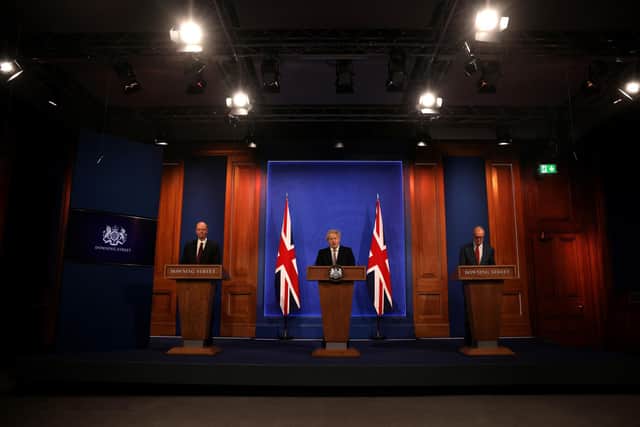 Chief Medical Officer Professor Chris Witty, Prime Minister Boris Johnson and Chief Scientific Adviser Sir Patrick Vallance attend a virtual press conference to announce changes to lockdown rules. Picture: Dan Kitwood-WPA Pool/Getty Images.