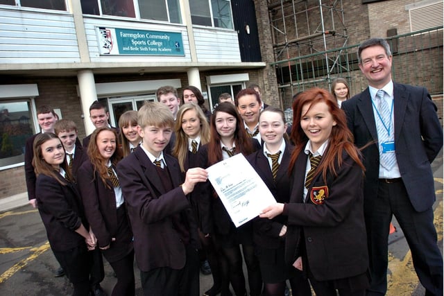 Farringdon Community Sports College head teacher Howard Kemp had every reason to be happy in 2012. Here he is with Year 9 pupils and the letter from the schools minister for being one of the most improved schools that year.