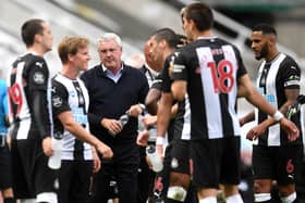 Steve Bruce, third left, with his players.