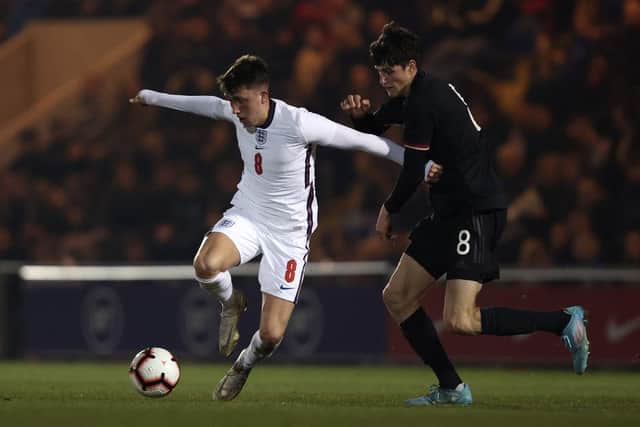 Sunderland midfielder Dan Neil playing for England's under-20s side against Germany.
