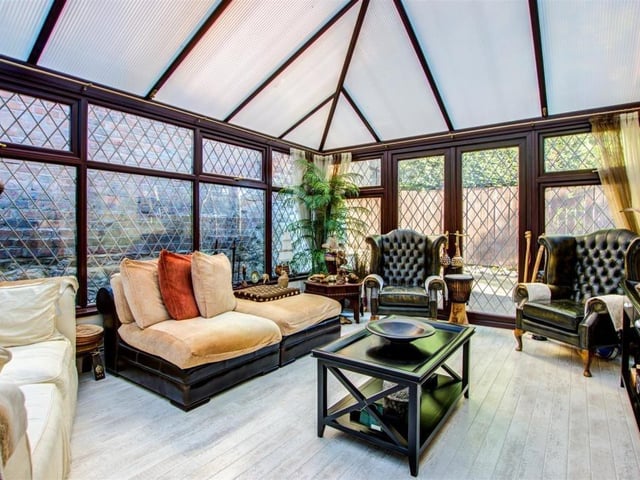 The property has a cosy space in the conservatory.