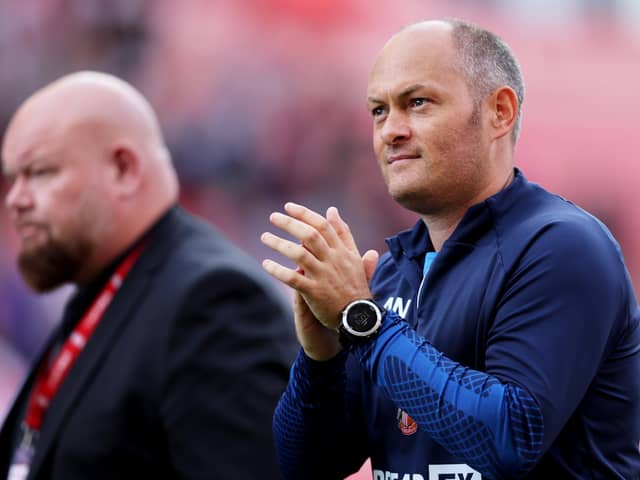 STOKE ON TRENT, ENGLAND - AUGUST 20: Sunderland manager Alex Neil applauds the fans after  his teams victory during the Sky Bet Championship between Stoke City and Sunderland at Bet365 Stadium on August 20, 2022 in Stoke on Trent, England. (Photo by Clive Brunskill/Getty Images)