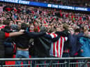 LONDON, ENGLAND - MARCH 02:  Sunderland fans celebrate during the Capital One Cup Final between Manchester City and Sunderland at Wembley Stadium on March 2, 2014 in London, England.  (Photo by Michael Regan/Getty Images)