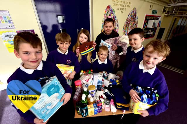 Hasting Hill Academy pupils with some of the many items donated to help refugee families from fleeing from Ukraine.