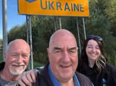 Kate Snowdon is pictured on her arrival in Ukraine with her dad Tom (left) and family friend Phil Billingham.
