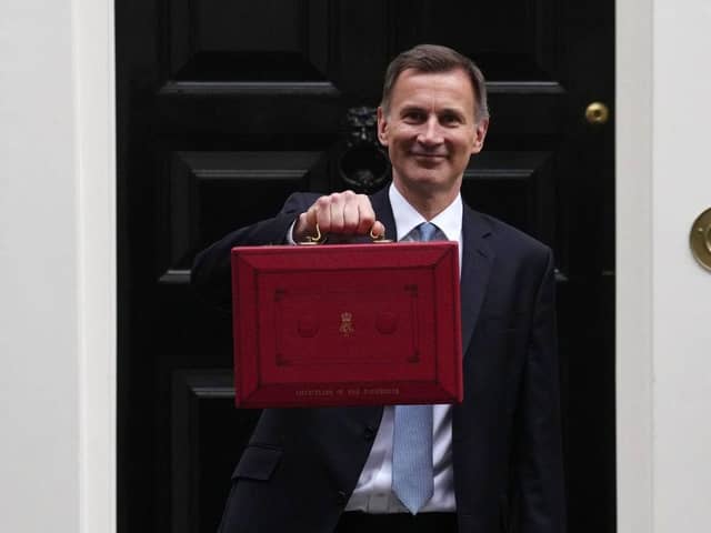 Chancellor Jeremy Hunt leaves Downing Street with the despatch box to present his spring budget