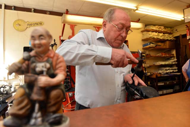 J.W. Hibbert cobblers celebrate 50 years in business with co-owner John Hibbert on the tools.