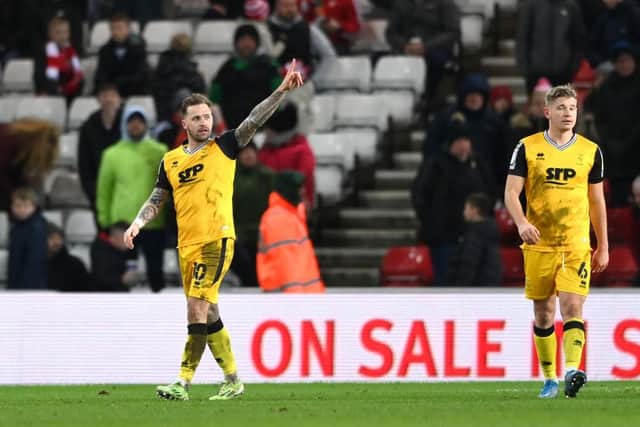 Lincoln player Chris Maguire celebrates his second goal against Sunderland.