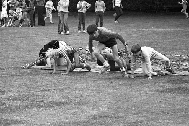 It's a close-run race on the obstacle course in 1983. Remember this?