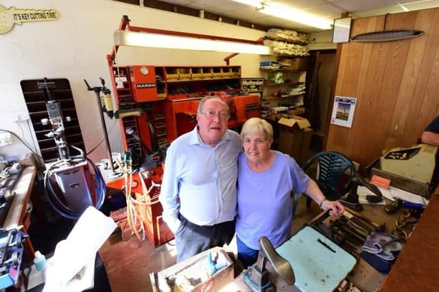 John and Jean Hibbert, pictured on their final day before retirement at their cobblers in Borough Road.