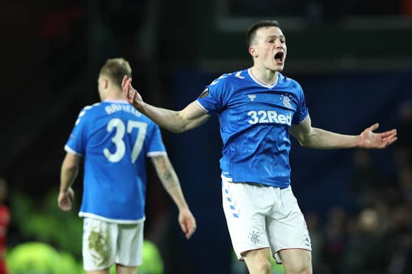 GLASGOW, SCOTLAND - MARCH 12: George Edmundson of Rangers FC celebrates after scoring his team's first goal during the UEFA Europa League round of 16 first leg match between Rangers FC and Bayer 04 Leverkusen at Ibrox Stadium on March 12, 2020 in Glasgow, United Kingdom. (Photo by Ian MacNicol/Getty Images)