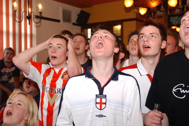 There's plenty of emotion for these England fans in the Ivy House as they watch the team in action against France in 2004.