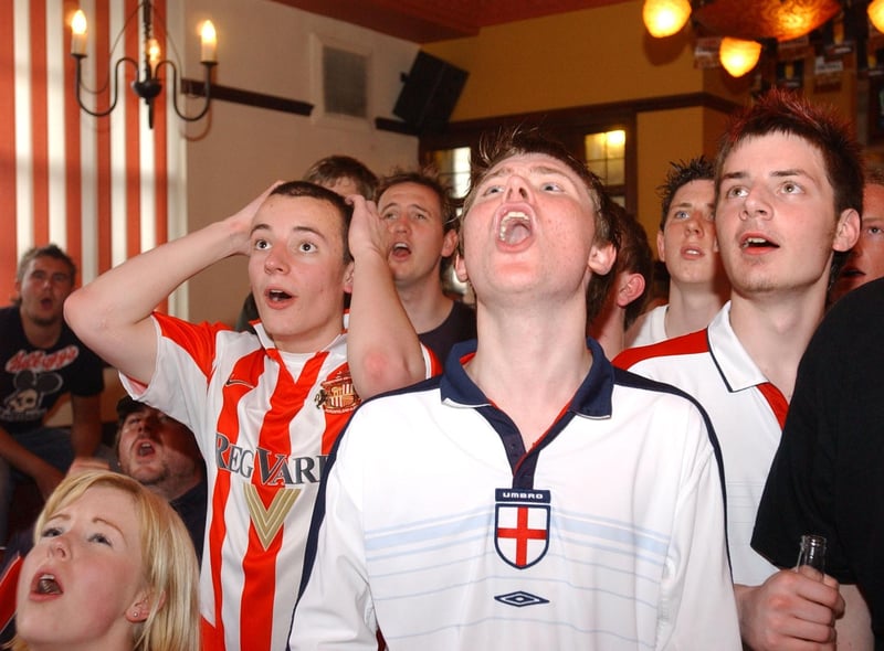 There's plenty of emotion for these England fans in the Ivy House as they watch the team in action against France in 2004.