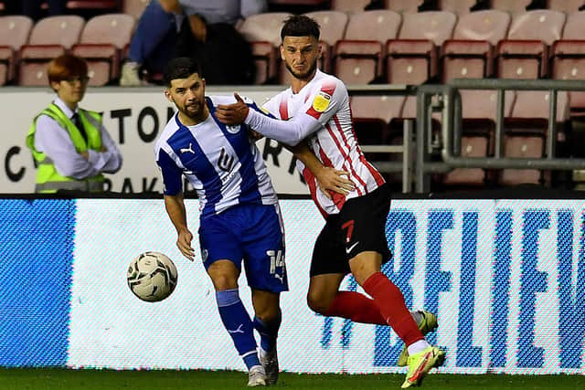 Leon Dajaku playing for Wigan against Sunderland in the Carabao Cup.
