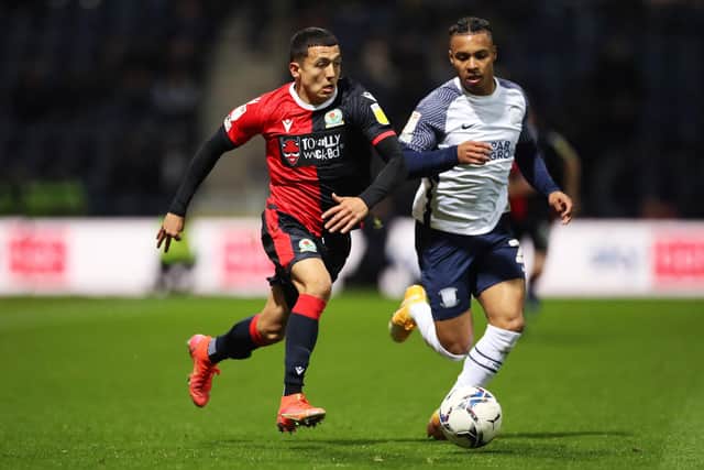 PRESTON, ENGLAND - APRIL 25: Ian Poveda-Ocampo runs with the ball under pressure from Cameron Archer of Preston North End during the Sky Bet Championship match between Preston North End and Blackburn Rovers at Deepdale on April 25, 2022 in Preston, England. (Photo by Lewis Storey/Getty Images)