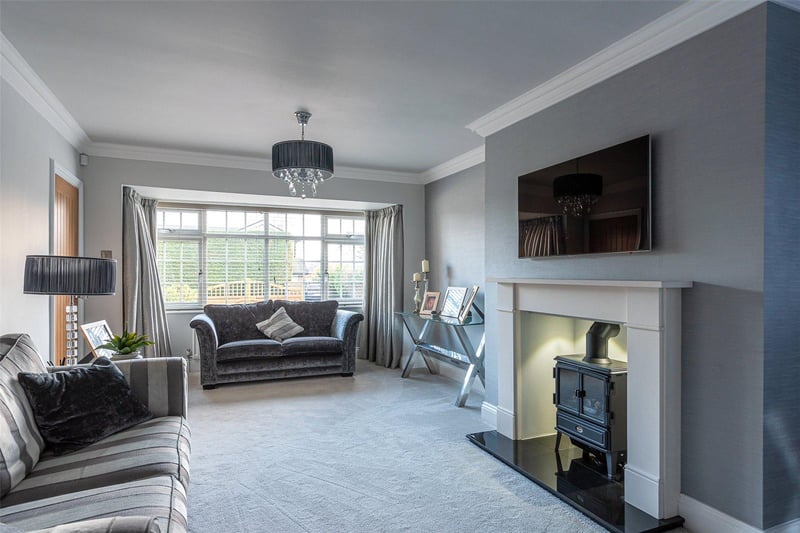 The spacious lounge is modern in design and features a traditional inset stove fire at its heart, providing a warm and cosy setting to relax in.