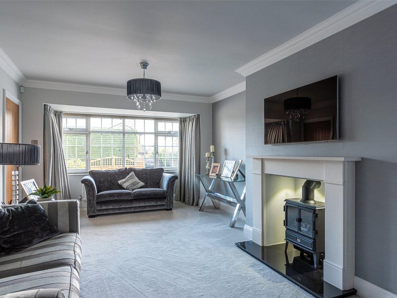 The spacious lounge is modern in design and features a traditional inset stove fire at its heart, providing a warm and cosy setting to relax in.