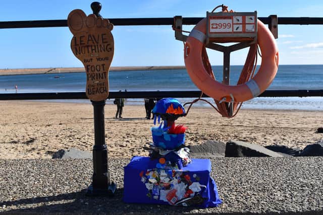 One of the students' recycled waste art sculptures with an important message for visitors to the beach.