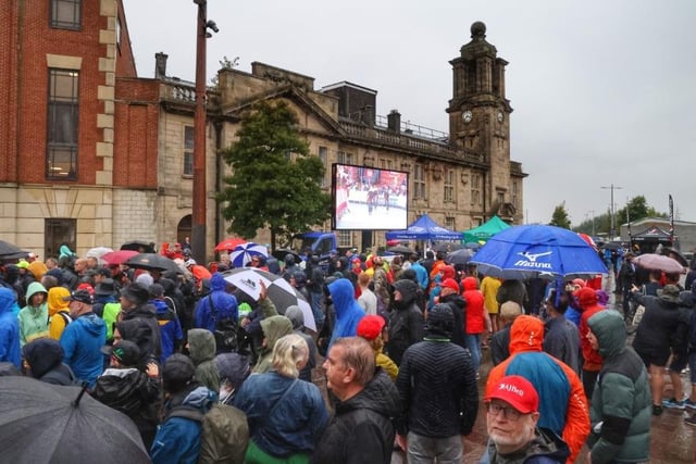 An excited crowd watch the cyclists arrive on a big screen at Keel Square, in Sunderland city centre